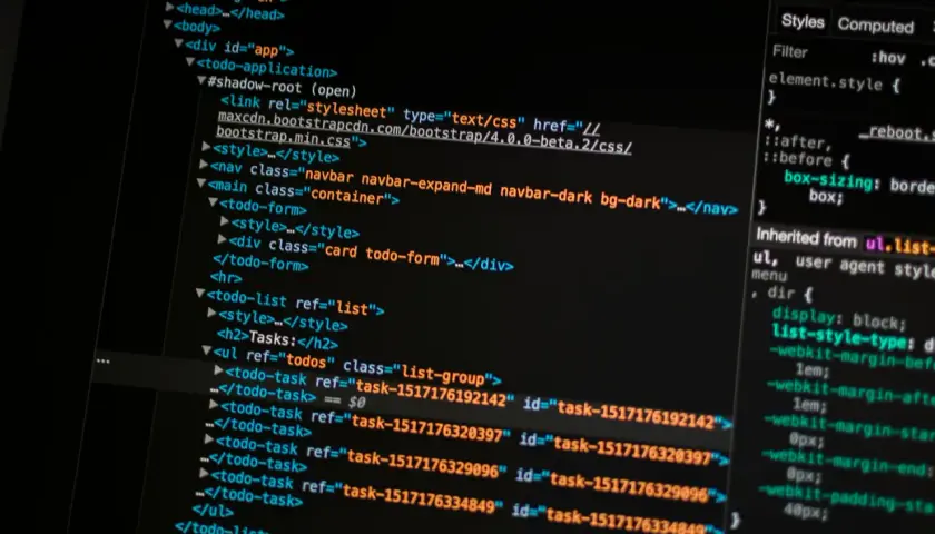 Kod HTML z linkiem do pliku CSS Bootstrap. To pokazuje, bootstrap to framework ułatwiający tworzenie responsywnych stron.