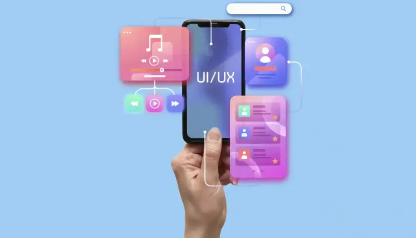 Dłoń trzyma smartfon z napisem UI/UX. Wokół telefonu widoczne są kolorowe elementy interfejsu, sugerujące audyt UX i projektowanie aplikacji.