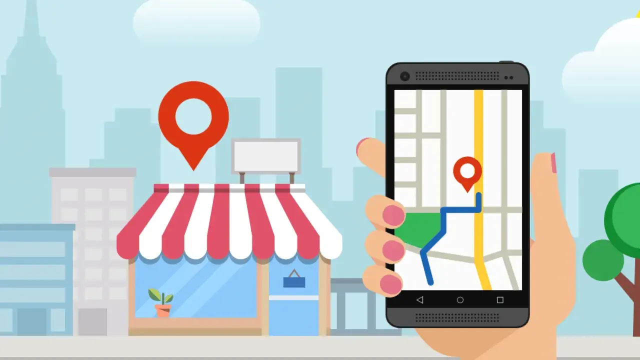 Smartfon z mapą i pinezką pokazuje drogę do sklepu. To klucz do skutecznego pozycjonowania lokalnego.