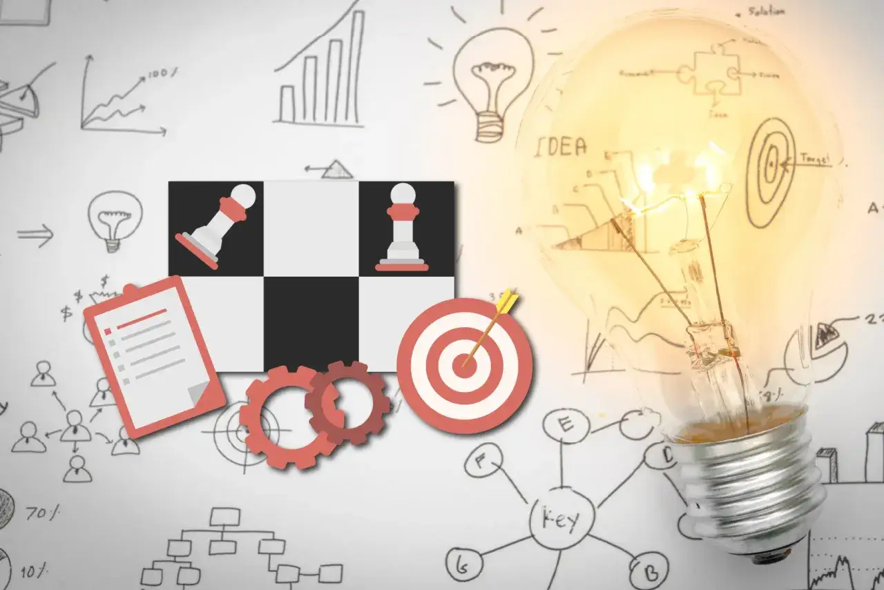 Strategia marketing w sieci: szachy, żarówka z pomysłem, cel i wykresy.